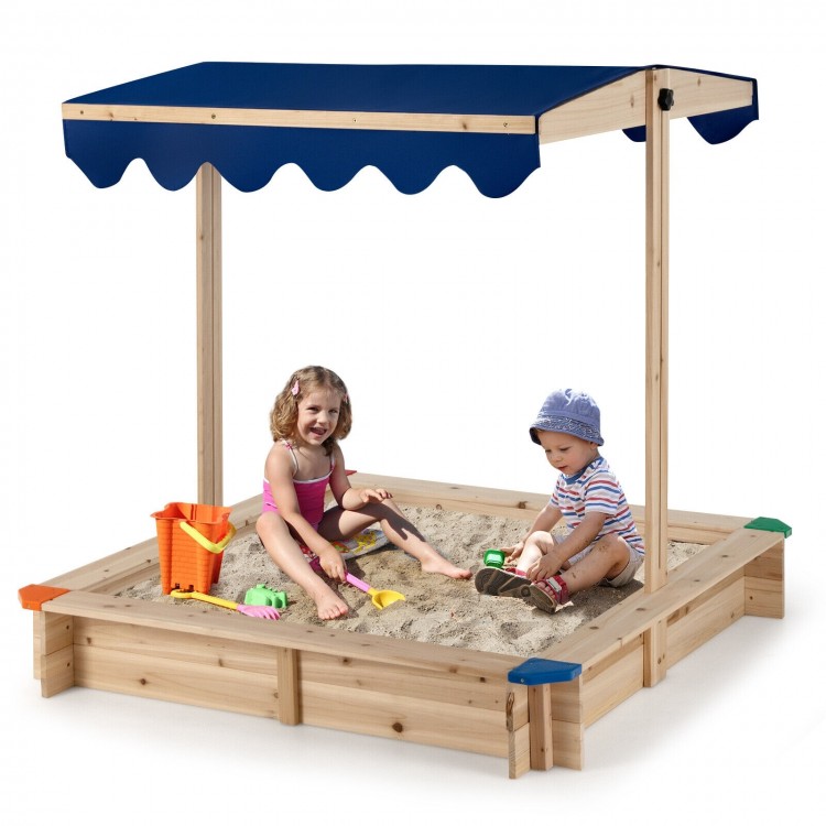 Kids wooden sandbox with height adjustable canopy, spacious for 2-4 kids, made of durable cedar wood for outdoor play.