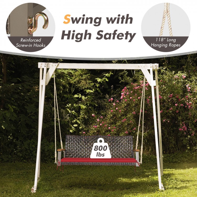 Rattan hanging porch swing chair for 2, featuring a sturdy steel frame, red cushion, and 800 lbs capacity for outdoor.