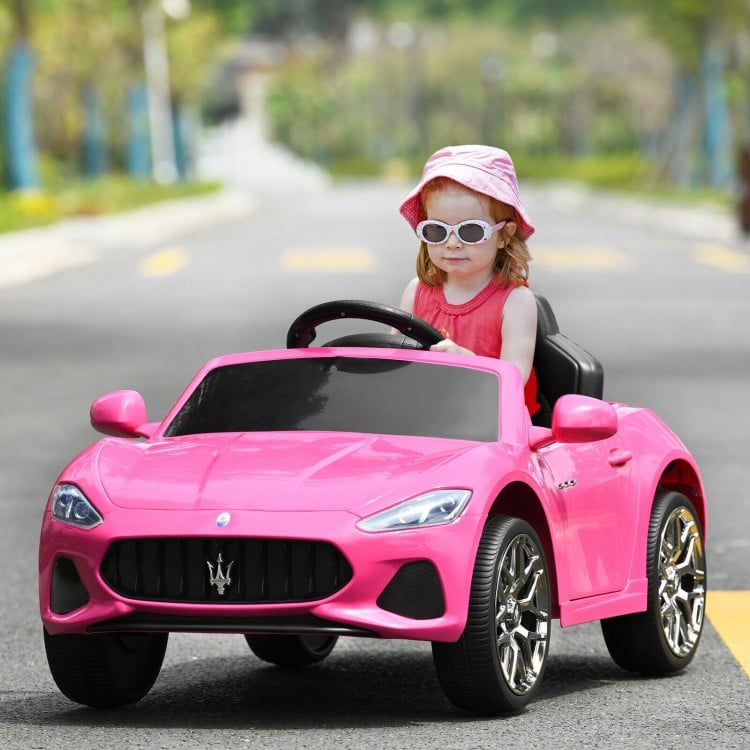 Pink 12V Maserati kids ride-on car with remote control, LED lights, and safety features for fun outdoor play.