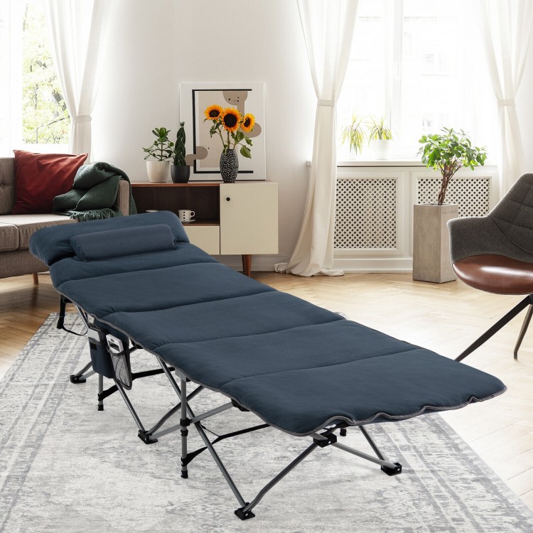 Folding camping cot in blue with removable velvet mattress and pillow, ideal for indoor and outdoor relaxation.