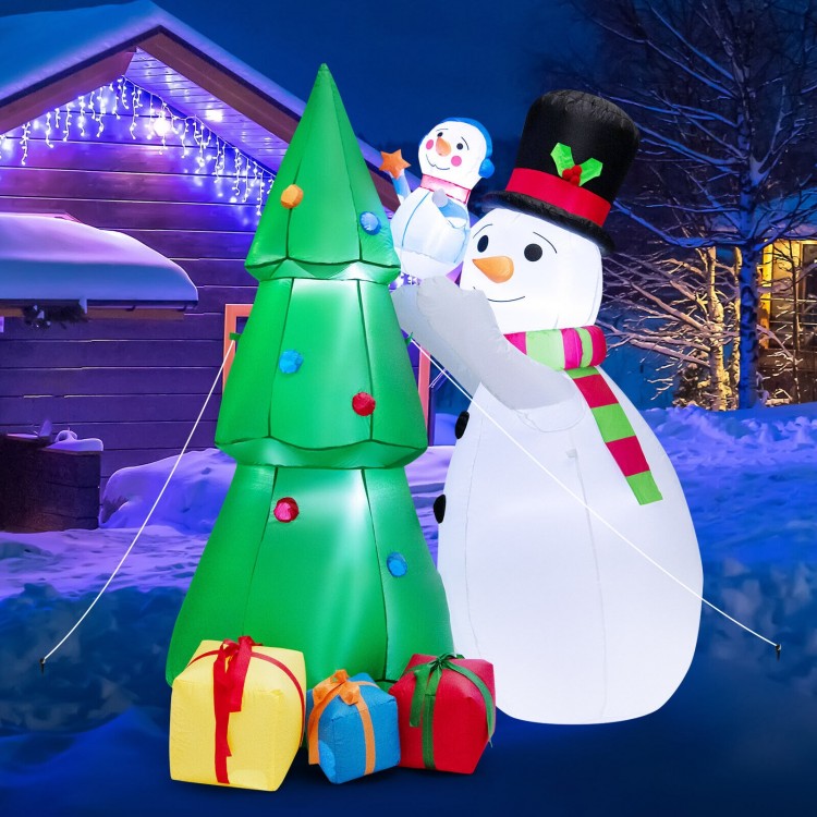 Inflatable Christmas snowman and tree set with LED lights, featuring gift boxes, perfect for festive outdoor decoration.