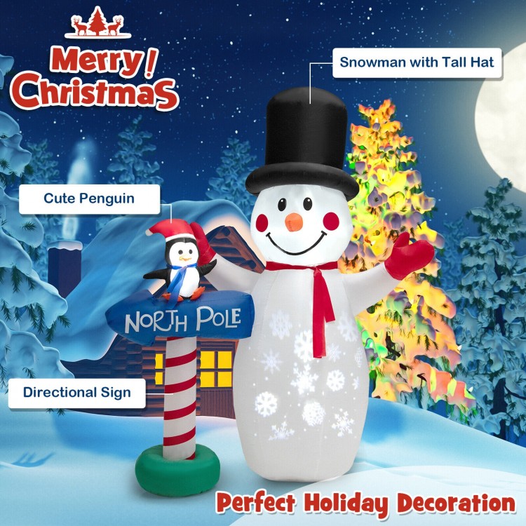 Snowman with tall hat and penguin on directional sign, 6 feet inflatable Christmas decoration for festive cheer.