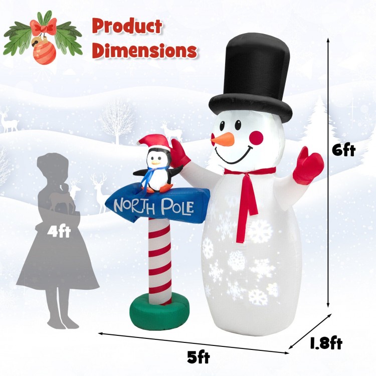 6-foot inflatable snowman decoration with penguin, built-in snowflake projector, ideal for indoor and outdoor holiday.