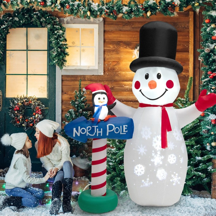 6-foot inflatable snowman and penguin decoration with snowflake projector, perfect for indoor or outdoor holiday.