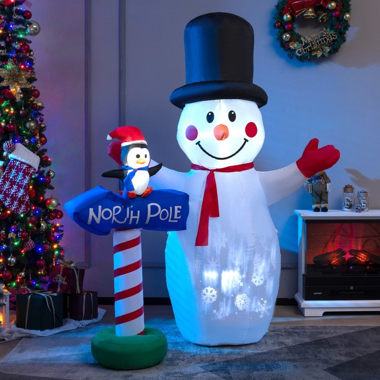 6-foot inflatable snowman with penguin and built-in snowflake projector, perfect for indoor or outdoor holiday.