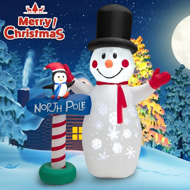 Front view of the 6-foot inflatable snowman with snowflake projector and penguin, ideal for cheerful holiday displays.