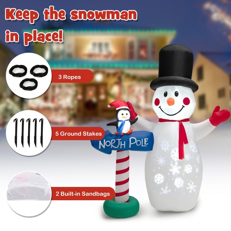6-foot inflatable snowman and penguin decoration with built-in projector, ropes, stakes, and sandbags for stability.