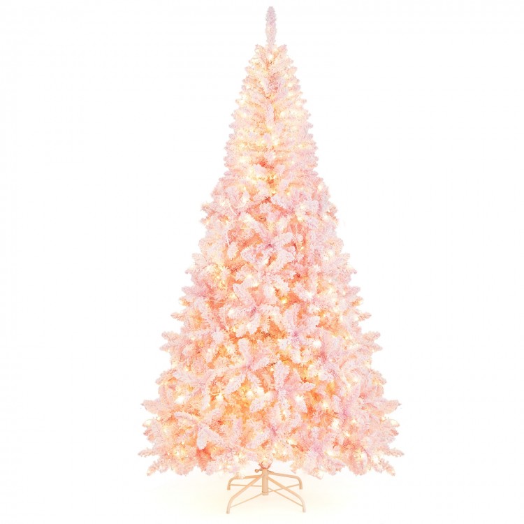 Flocked pink Christmas tree standing 7.5 feet tall, featuring 1100 branch tips and a sturdy foldable metal stand.