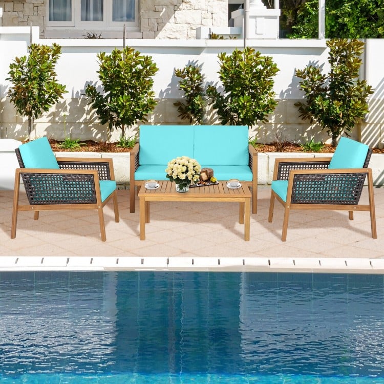 Close-up of the turquoise cushion on a patio chair from a 4-piece rattan furniture set, offering comfort and style for.