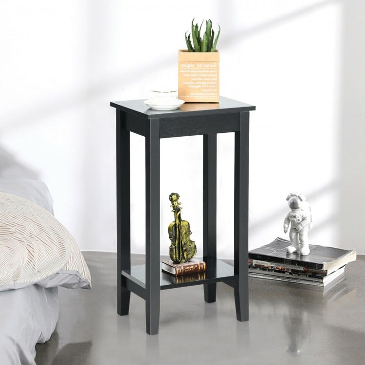 Black 2-tier nightstand with solid wood legs, featuring ample storage for bedroom or living room use.