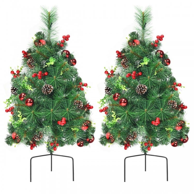Set of 2 pre-lit 29-inch Christmas trees with ornaments, pine cones, and battery-powered design for festive decoration.