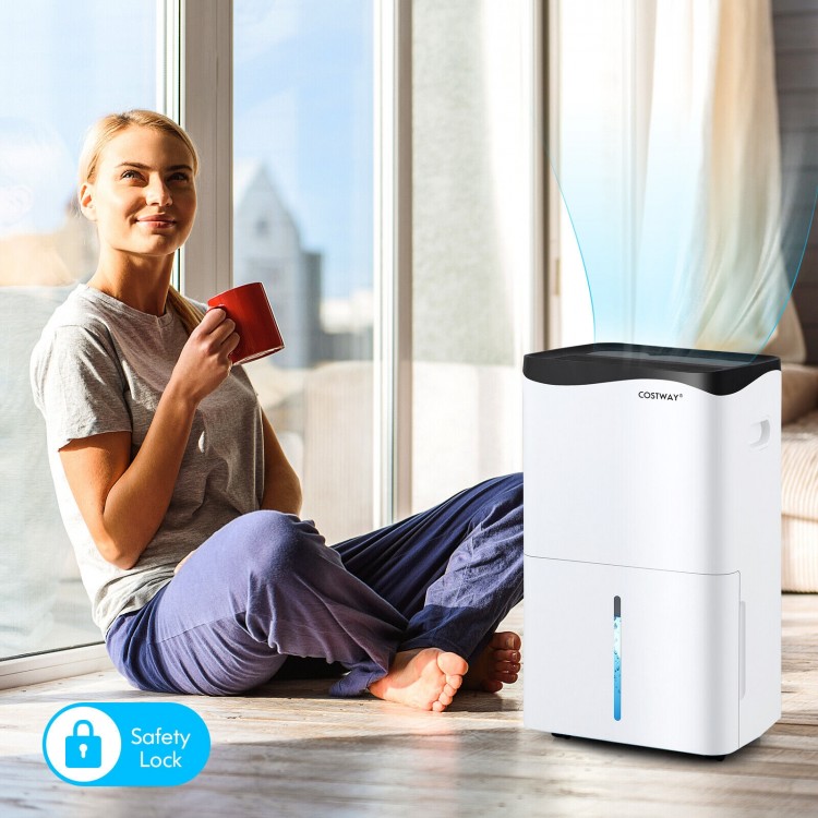 100-pint dehumidifier in white with smart app control, ideal for large rooms up to 5500 sq.ft, shown in a cozy setting.