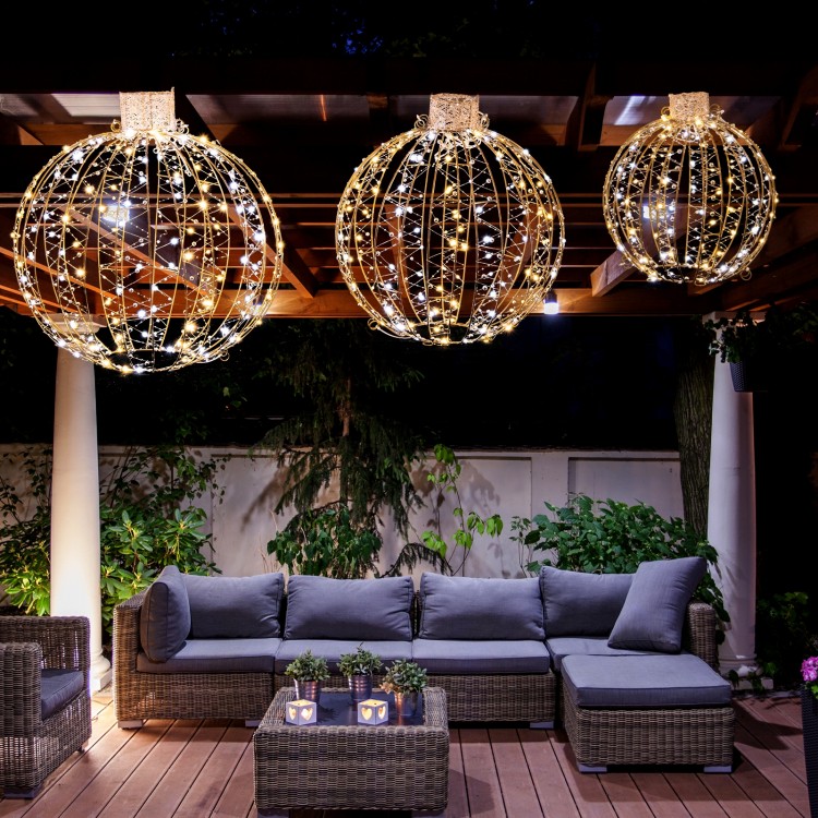 Three decorative Christmas LED light balls in golden hues, showcasing warm and white lights for festive outdoor.