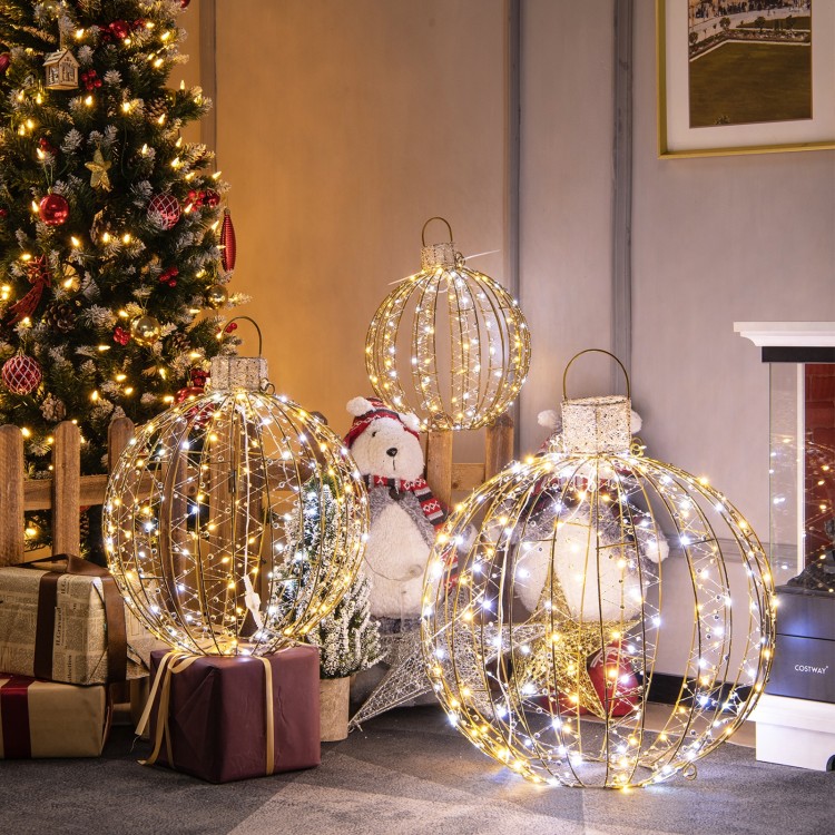 Three decorative Christmas LED light balls in gold, featuring warm and white lights, perfect for festive indoor or.