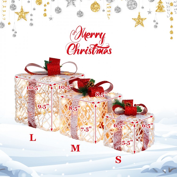 Set of 3 lighted Christmas gift boxes with red bows, featuring snow cover and warm-white LED lights for festive decor.
