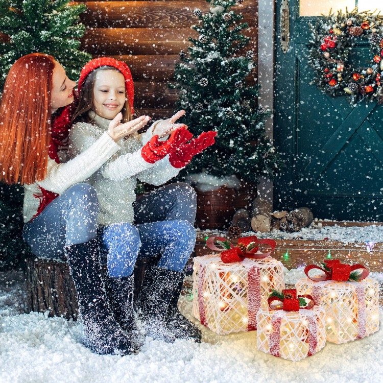 Set of 3 Christmas lighted gift boxes with red bowknots, covered in snow, perfect for outdoor holiday decorations.