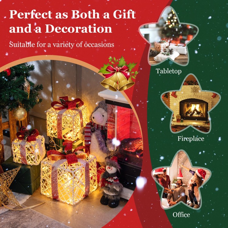 Single large lighted Christmas gift box with a red bow, adorned in snow, perfect for festive tabletop decoration.