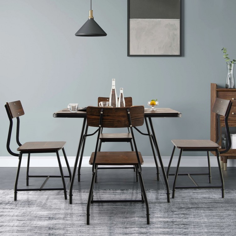 Industrial-style dining table set with metal frame and curved backrest chairs, perfect for four-person gatherings.