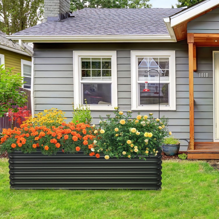 Dark gray 71-inch galvanized metal raised garden bed with vibrant flowers, ideal for backyard gardening and plant.