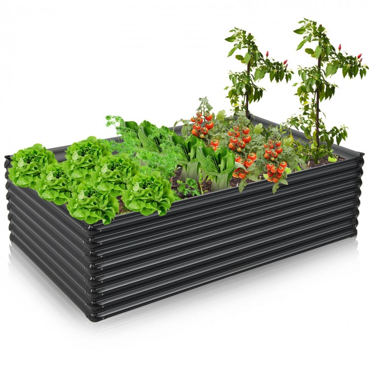 Galvanized metal raised garden bed in dark gray, featuring wave-shaped design and bottomless construction for plant.