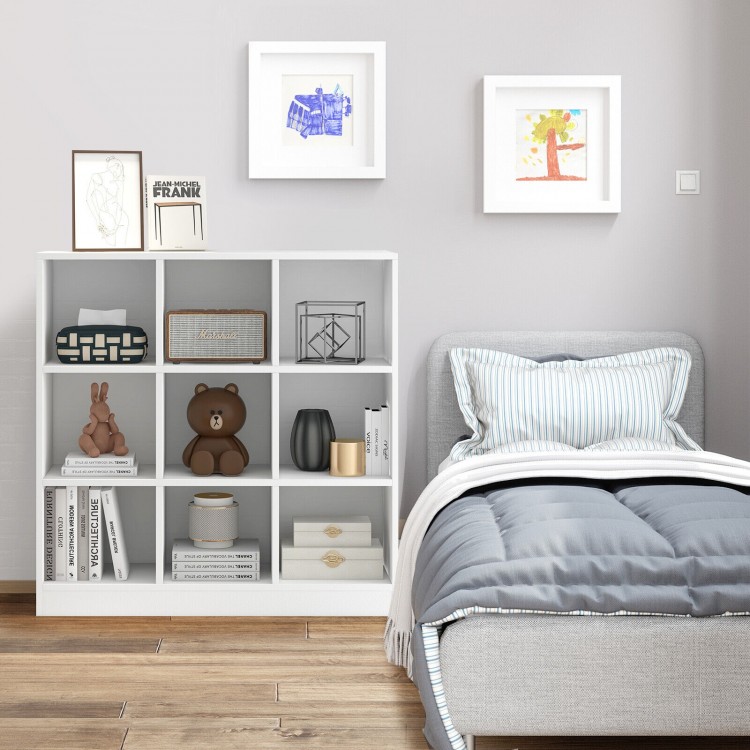 Modern 9-cube bookcase in white with toys and books, ideal for kids' room organization and stability with anti-tipping.
