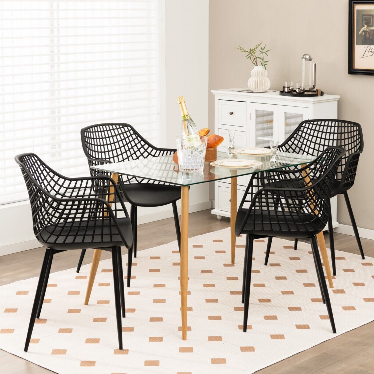 Set of 4 black modern dining chairs with airy hollow backrest, featuring sturdy metal legs, ideal for indoor dining.