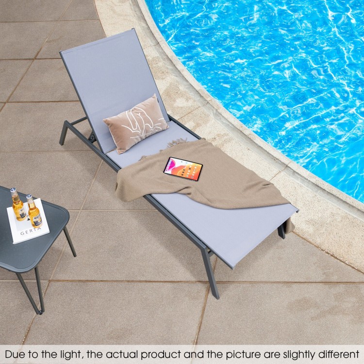 Adjustable outdoor chaise lounge chair in gray with quick-drying fabric, perfect for poolside relaxation.