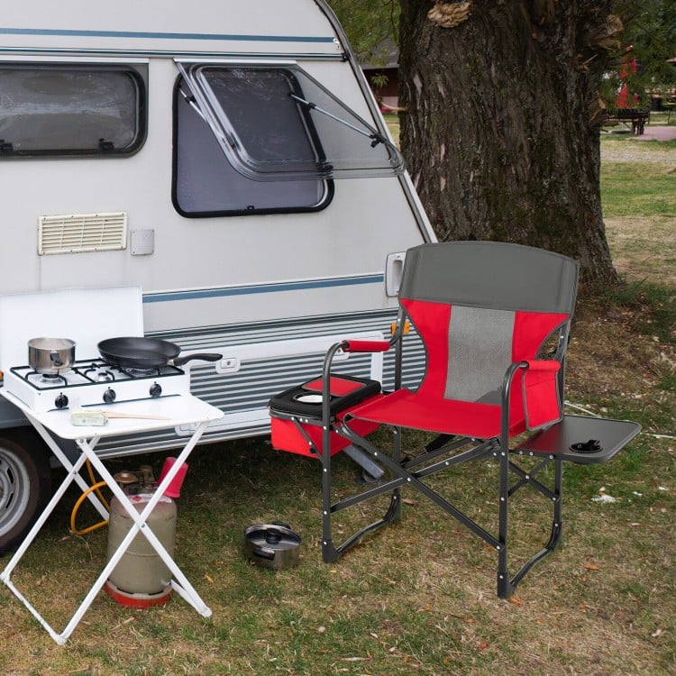 Folding camping directors chair in red with cooler bag and side table, perfect for outdoor use and easy transportation.