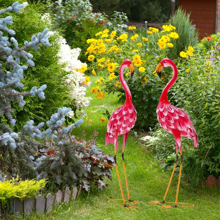 Two vibrant pink flamingo garden statues with U-shaped stakes, adding charm to your backyard or garden decor.