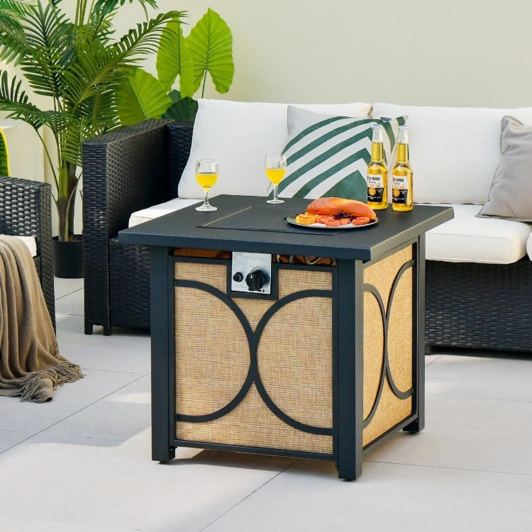 Square fire pit table with cover, 50,000 BTU heat output, and durable metal frame, perfect for outdoor gatherings.