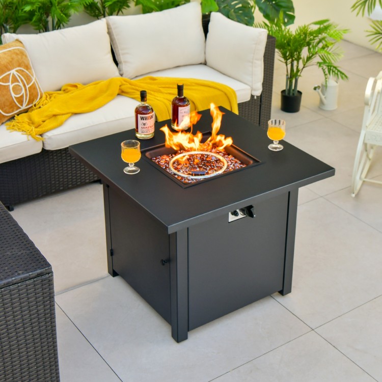 Square propane gas fire pit table with 50,000 BTU heat output, surrounded by drinks and a cozy seating area.