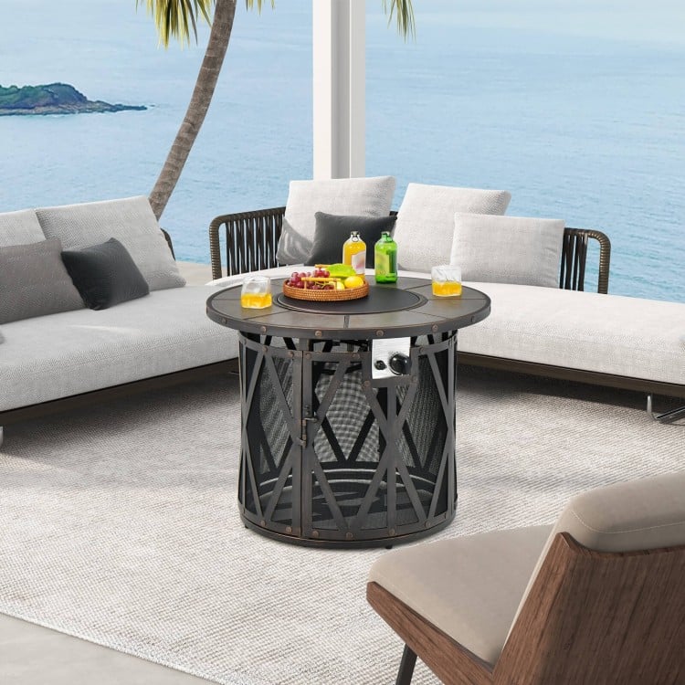 32-inch fire pit table with mesh design, 30,000 BTU output, used as coffee table, ideal for outdoor gatherings.