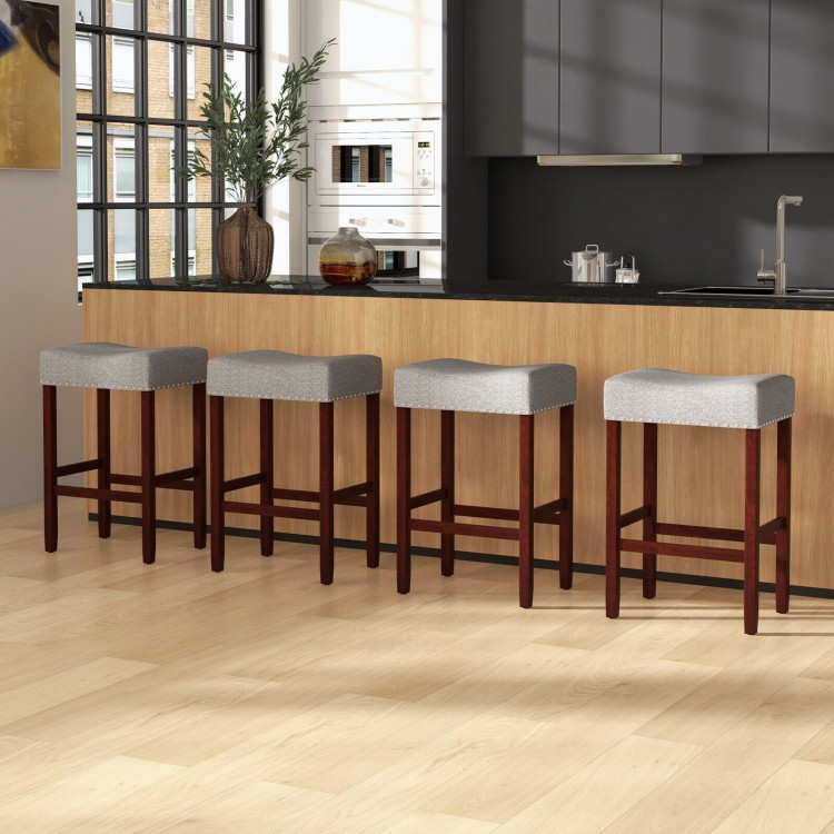 Set of two 25-inch gray bar stools with cushioned seats and rubber wood legs, perfect for kitchen or dining areas.