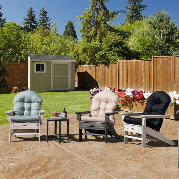 Three patio Adirondack chairs with cushions in black, gray, and beige, set in a garden for outdoor relaxation.