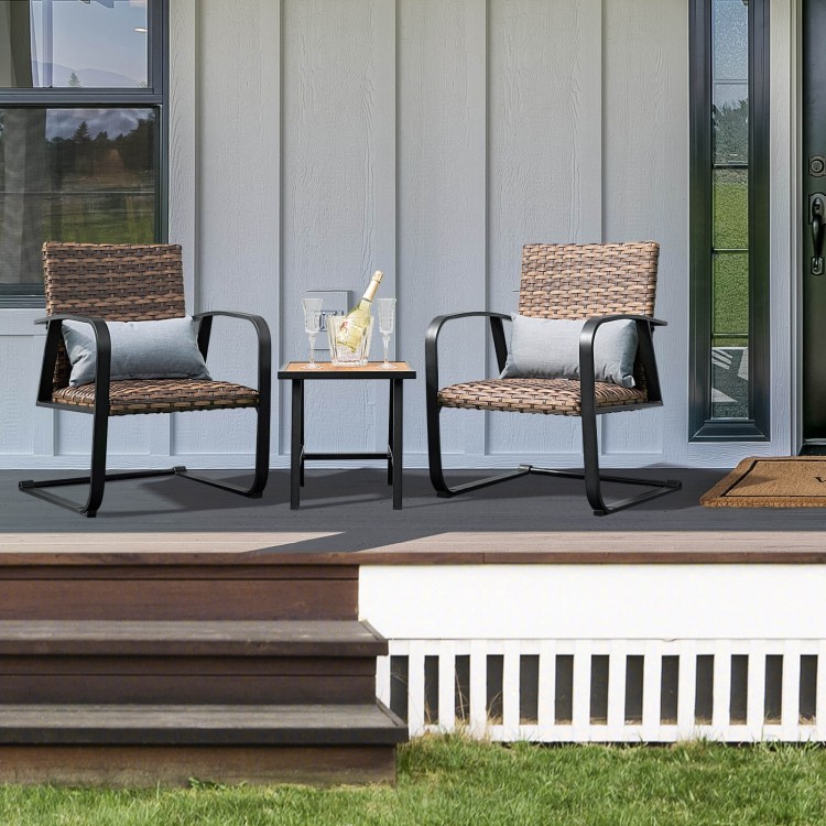 Patio rattan conversation set featuring two chairs and a table, with quick-dry lumbar pillows for outdoor relaxation.