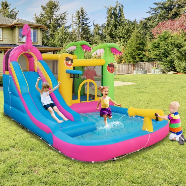 Inflatable bounce castle with water slide, featuring a pink design, water gun, and mesh netting for kids' summer fun.