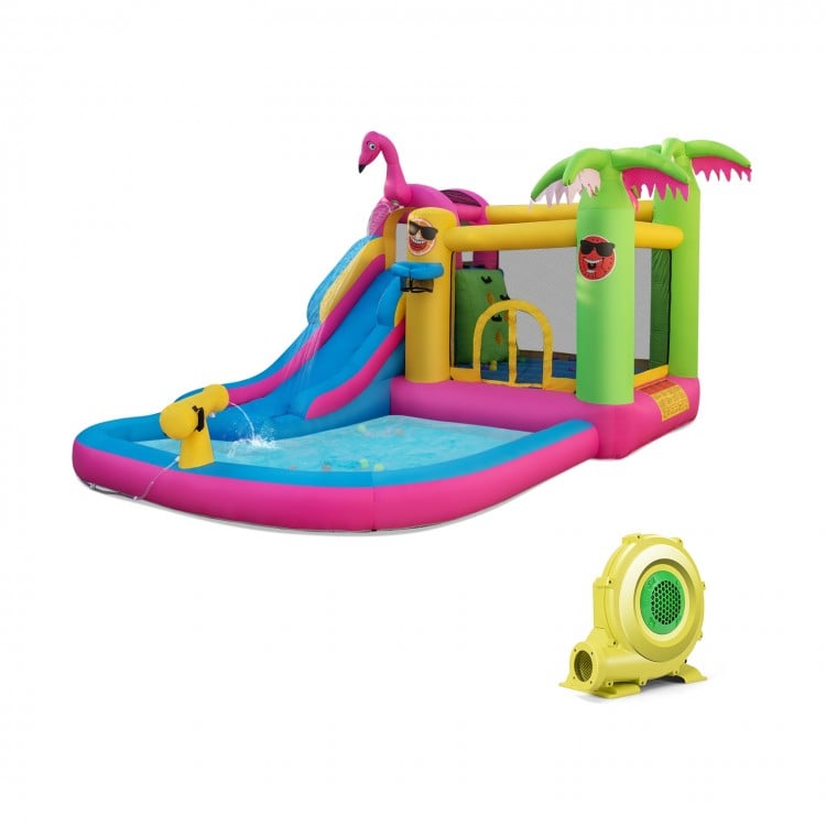 Inflatable bounce castle with long water slide, featuring a pink and green design, perfect for summer fun and play.
