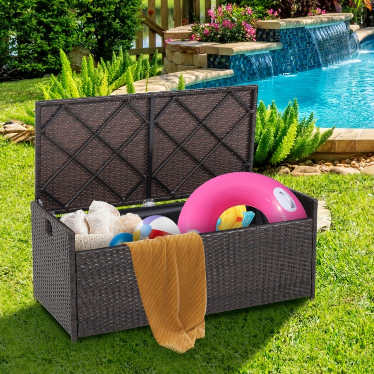 Patio storage bench with seat cushion, made of durable brown PE rattan, ideal for outdoor organization and seating.