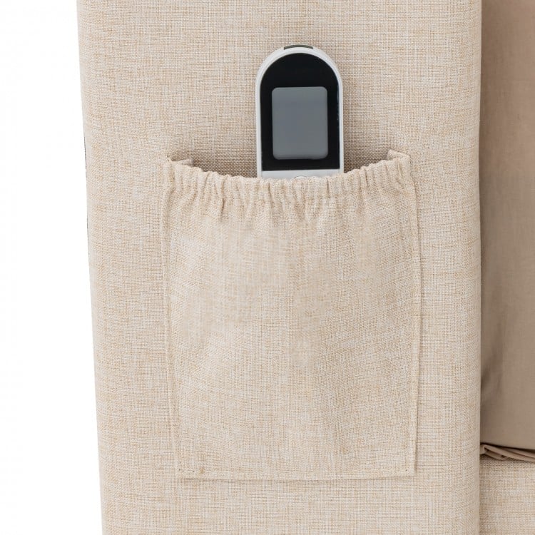 Close-up of the elastic pocket on the upholstered bed frame, ideal for storing remote controls and smartphones.