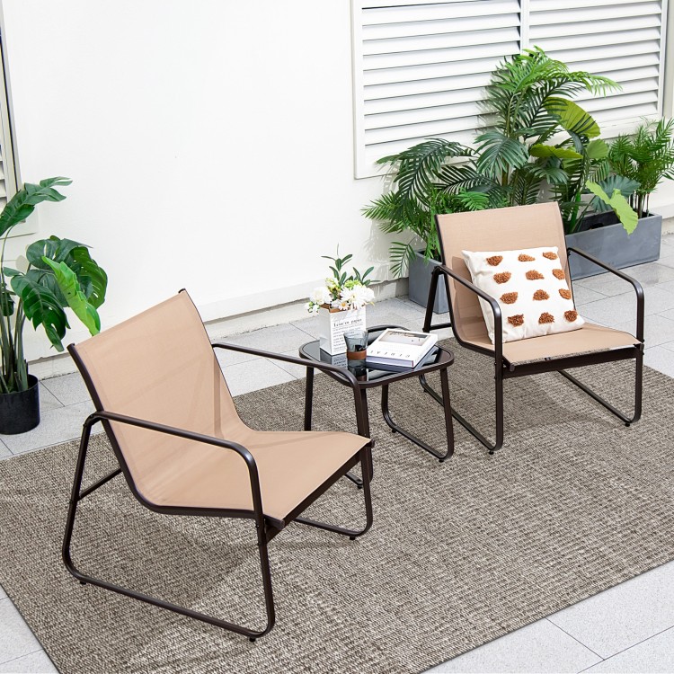 Two brown patio chairs with ergonomic design and a glass-top table, perfect for backyard relaxation.