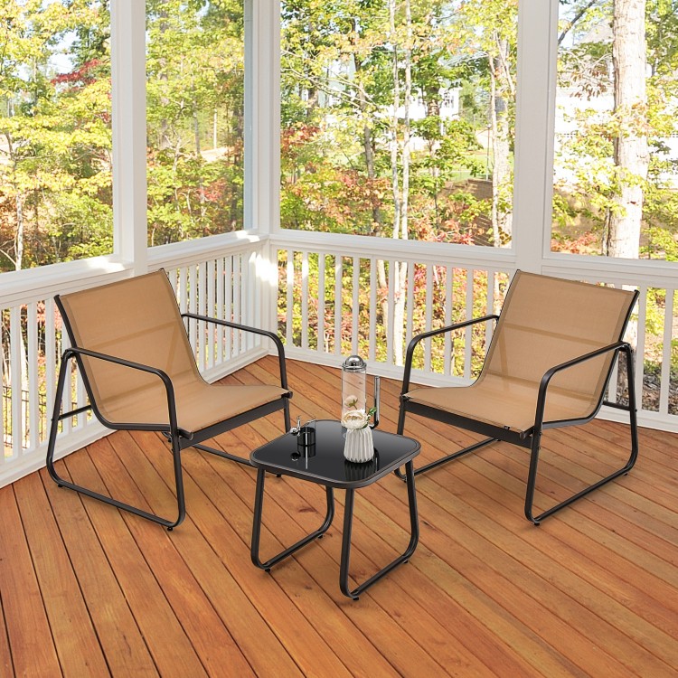 Two ergonomic patio chairs with breathable fabric and a glass-top table, perfect for backyard relaxation.