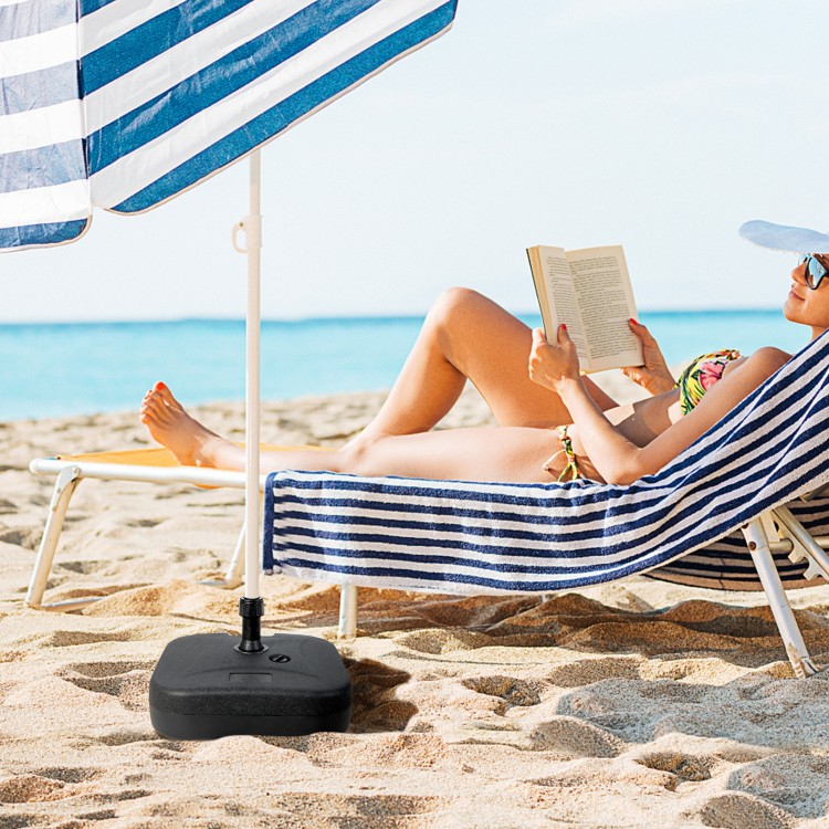 Fillable black patio umbrella base with handle, designed for 1.5-inch poles, providing stability for beach or patio use.