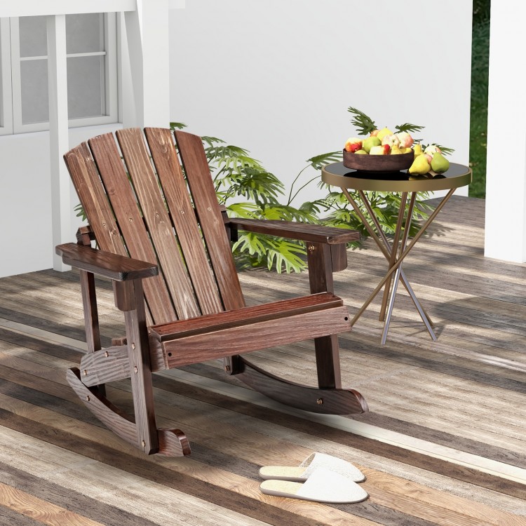 Outdoor wooden kid Adirondack rocking chair in coffee color with slatted seat, perfect for relaxing on the patio.