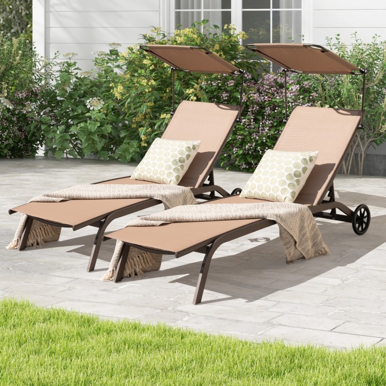 Adjustable brown chaise lounge chairs with canopies and cup holders, perfect for poolside relaxation in your backyard.