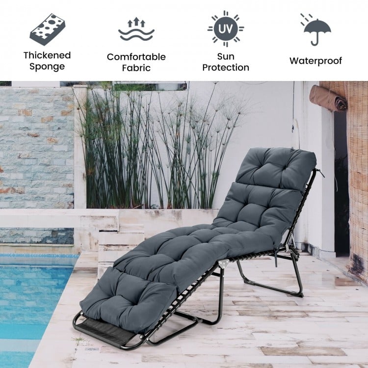 Gray outdoor lounge chaise cushion with string ties, made of waterproof polyester for garden or poolside use.