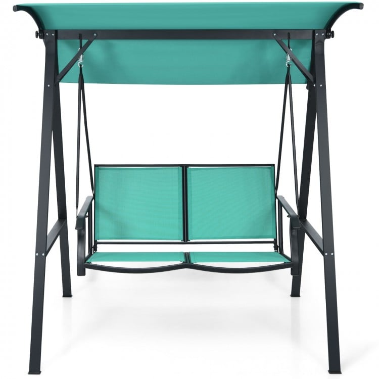 Two-person patio swing with green weather-resistant canopy and sturdy steel frame, perfect for outdoor relaxation.