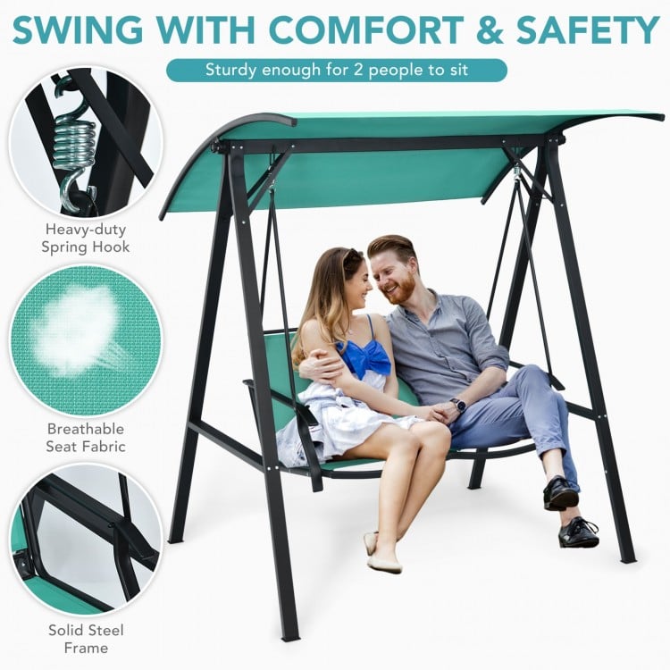 Two-person patio swing with adjustable green canopy, sturdy steel frame, and breathable seat for outdoor relaxation.