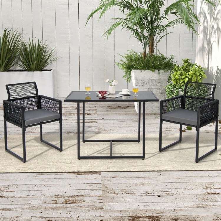 3-piece outdoor dining set featuring gray cushions, hand-woven PE rattan, and a spacious tempered glass table for.