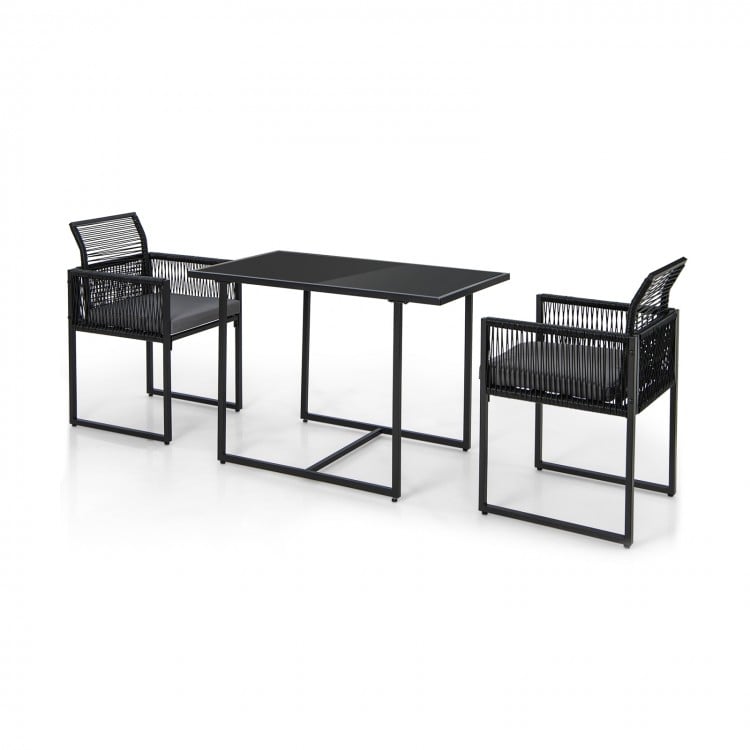 3-piece outdoor dining set featuring a gray tempered glass table and hand-woven PE rattan chairs with cushions.