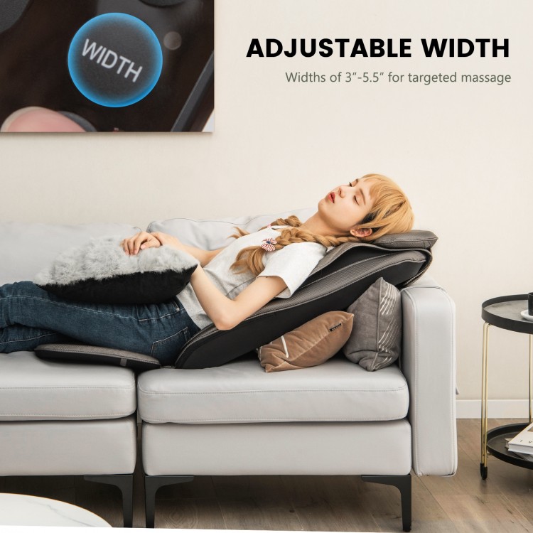 Massage chair pad in black, featuring adjustable width of 3"-5.5" for targeted heat and vibration massage on a sofa.